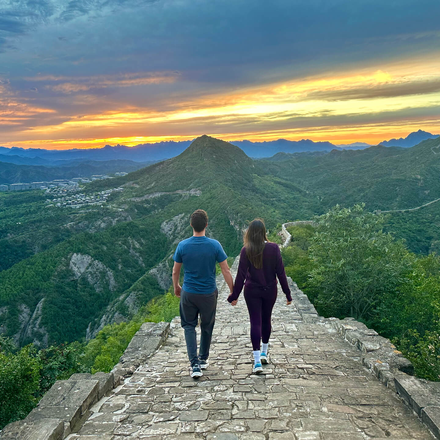 Juli and Rob walking great wall of china